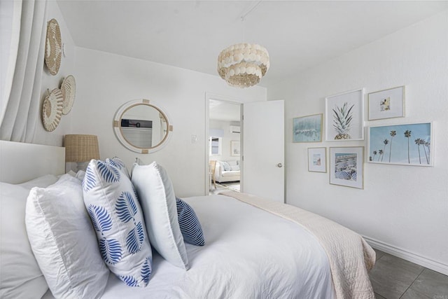 bedroom featuring an inviting chandelier