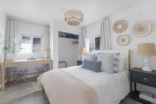 bedroom with an inviting chandelier