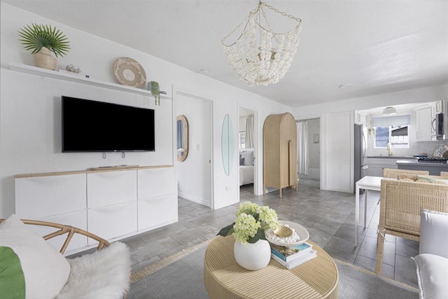 living room featuring a notable chandelier