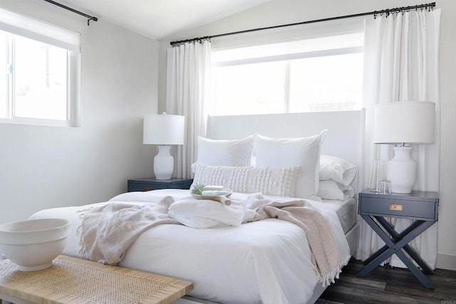 bedroom featuring dark wood-type flooring and lofted ceiling