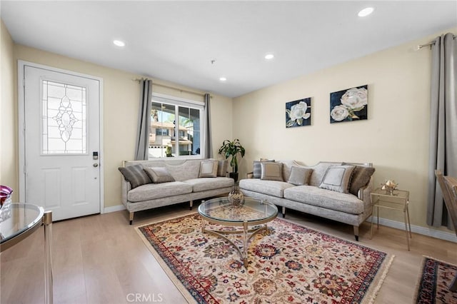 living room with light hardwood / wood-style flooring