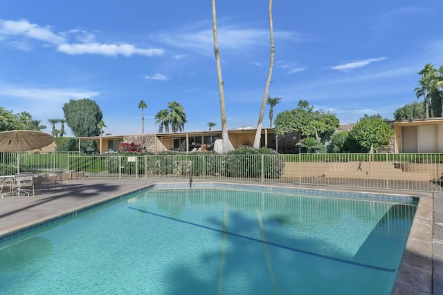 view of swimming pool featuring a patio area