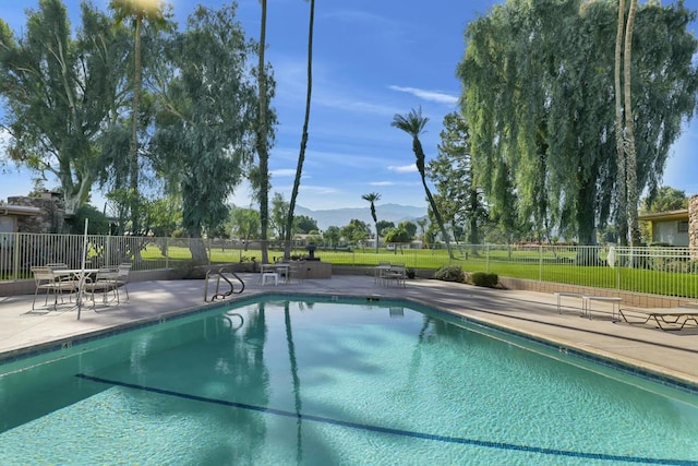 view of swimming pool with a patio