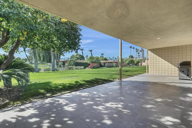 view of patio featuring a grill