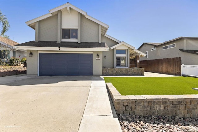 view of front of house with a garage and a front yard