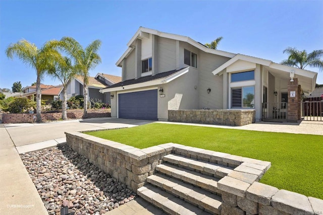 view of front of property featuring a front lawn and a garage