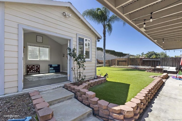 view of yard with an outdoor living space and a patio