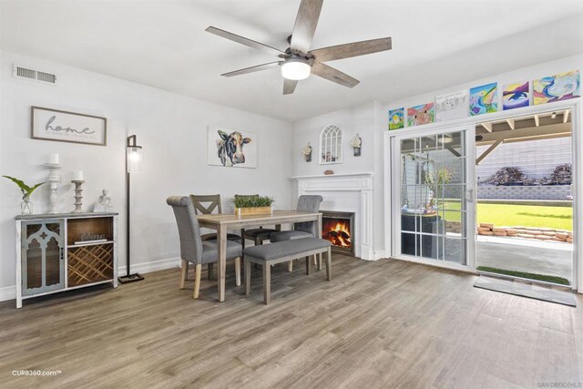 dining room featuring hardwood / wood-style flooring and ceiling fan