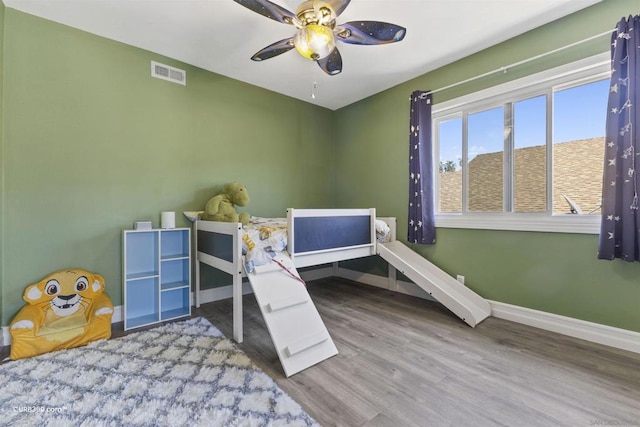 bedroom featuring ceiling fan and hardwood / wood-style flooring