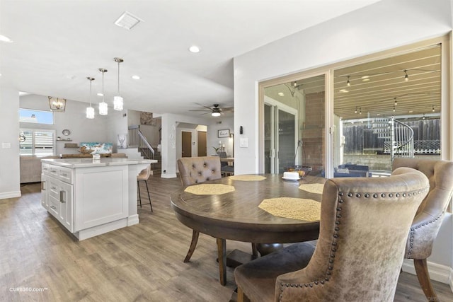 dining room featuring ceiling fan and light hardwood / wood-style flooring