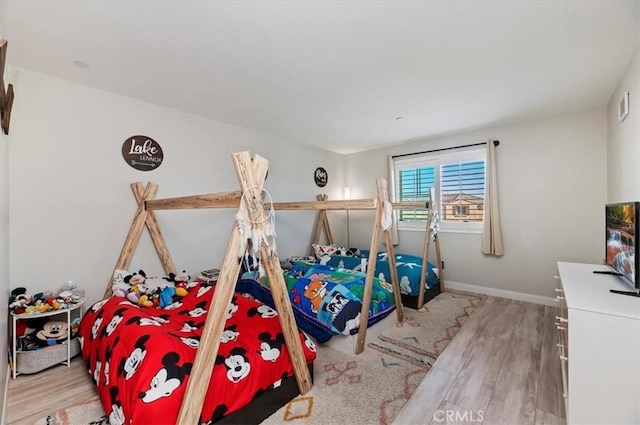 bedroom featuring light wood-type flooring