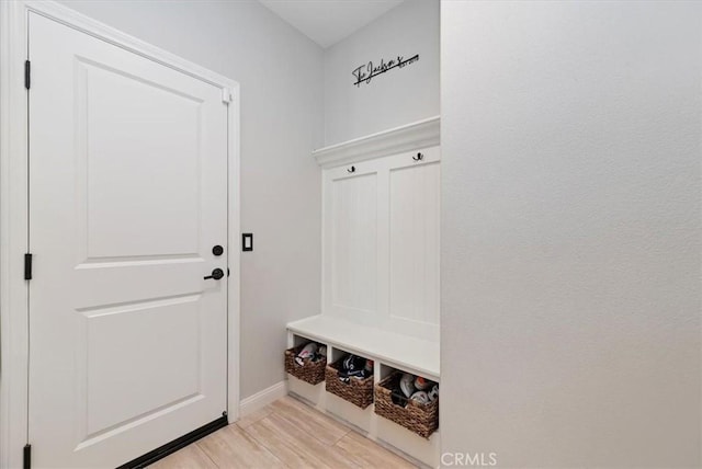 mudroom with light hardwood / wood-style flooring