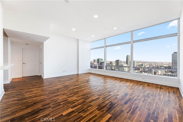 unfurnished living room featuring dark wood-type flooring