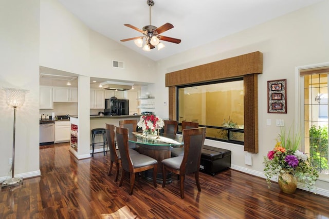 dining room featuring ceiling fan, dark hardwood / wood-style floors, and high vaulted ceiling