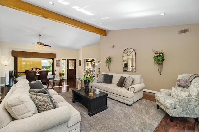 living room featuring ceiling fan, hardwood / wood-style floors, and vaulted ceiling with beams