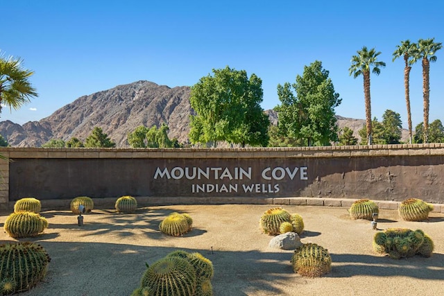 community sign featuring a mountain view