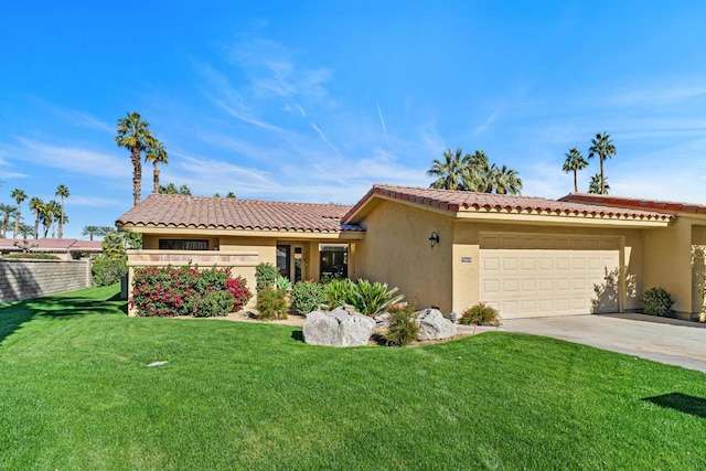 view of front of home with a garage and a front yard