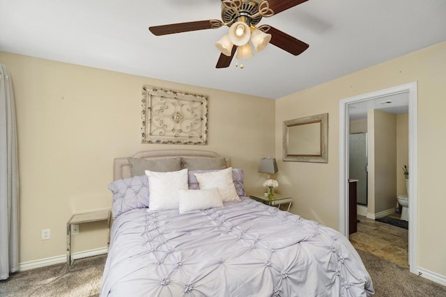 bedroom featuring ceiling fan, connected bathroom, and carpet floors