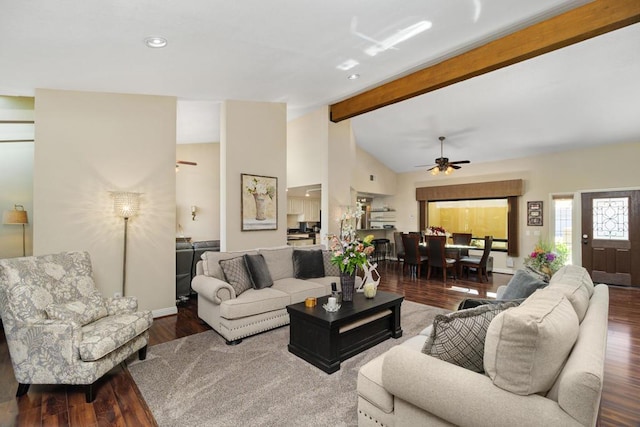 living room featuring ceiling fan, wood-type flooring, and vaulted ceiling with beams