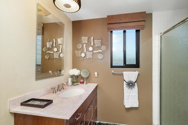 bathroom featuring vanity and an enclosed shower