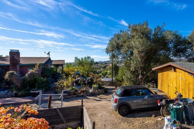 exterior space featuring a shed