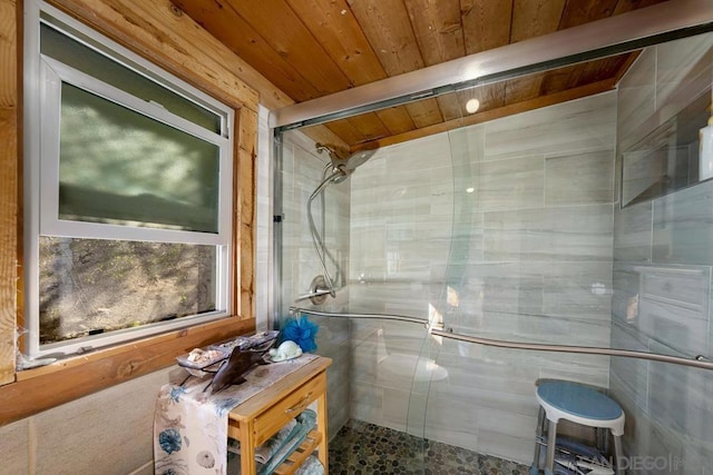 bathroom with wood ceiling and an enclosed shower