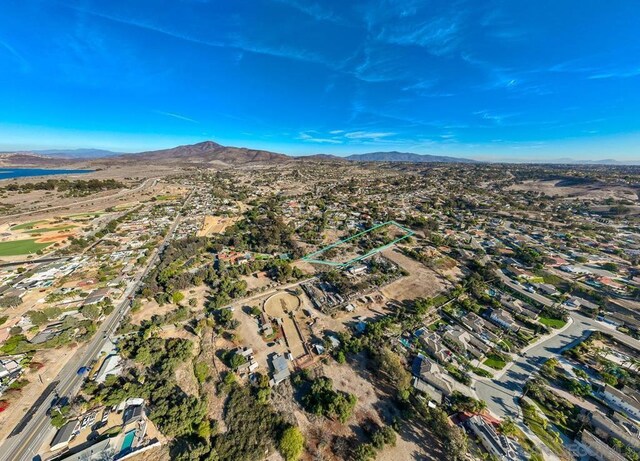 birds eye view of property with a mountain view