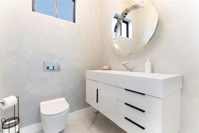 bathroom with toilet and vanity