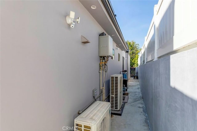 view of side of home featuring ac unit