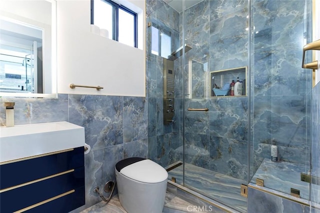 bathroom featuring toilet, tile walls, an enclosed shower, and vanity