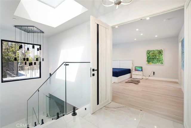 bathroom featuring a skylight