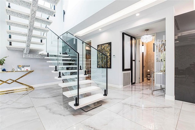 stairway with an inviting chandelier