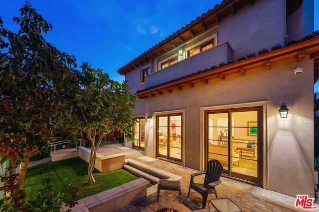 rear view of house featuring a patio