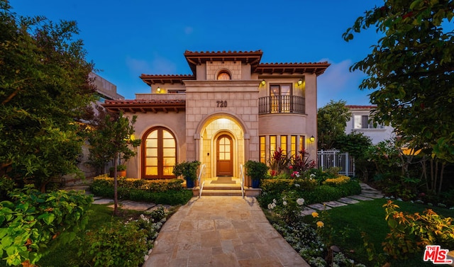 mediterranean / spanish-style home featuring a balcony