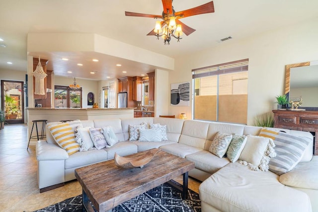 tiled living room with ceiling fan