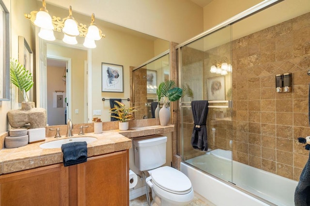 full bathroom with toilet, vanity, a chandelier, and combined bath / shower with glass door