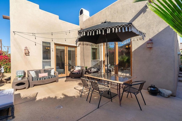 view of patio featuring outdoor lounge area and french doors