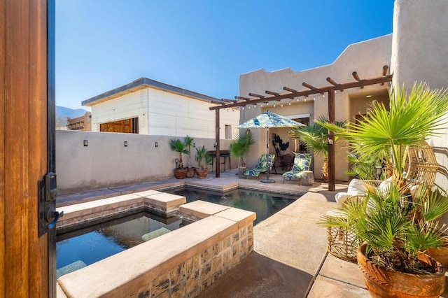 view of swimming pool featuring an in ground hot tub and a patio