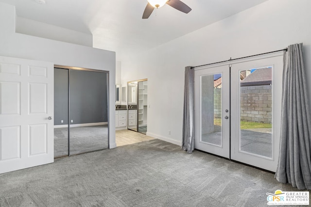 unfurnished bedroom with ceiling fan, access to outside, a closet, light colored carpet, and french doors