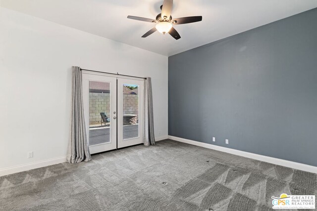 spare room with light carpet, french doors, and ceiling fan