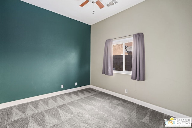 carpeted empty room with ceiling fan