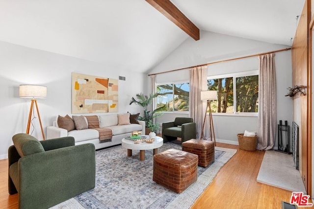 living room with lofted ceiling with beams and wood-type flooring