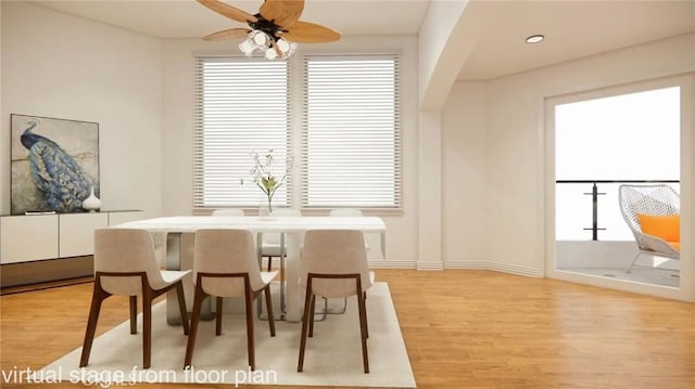 dining space with ceiling fan and light hardwood / wood-style flooring