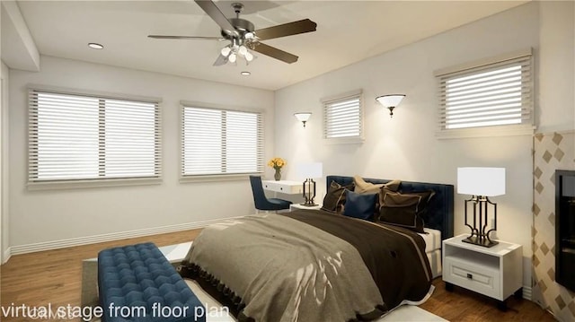 bedroom featuring ceiling fan and dark hardwood / wood-style floors