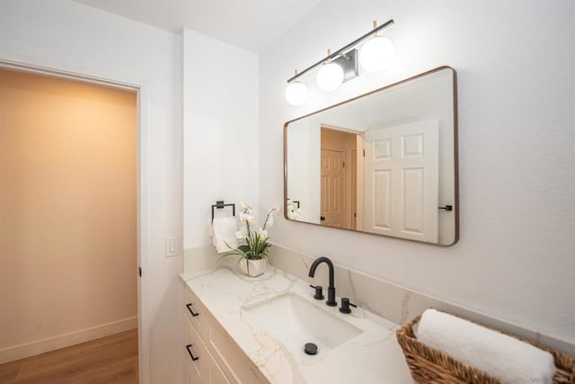 bathroom featuring vanity and hardwood / wood-style floors