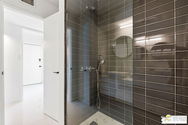 bathroom with tiled shower