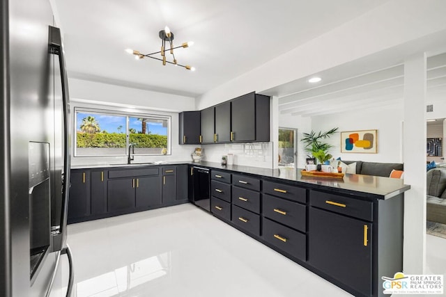 kitchen with sink, stainless steel fridge, dishwasher, a notable chandelier, and decorative backsplash