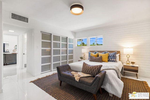 bedroom with wooden walls