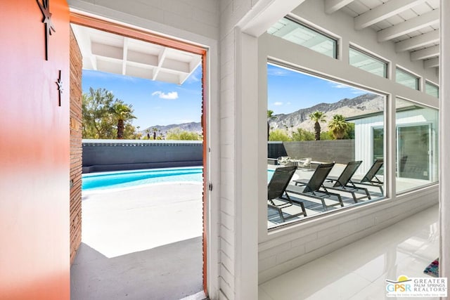 interior space with a mountain view and plenty of natural light