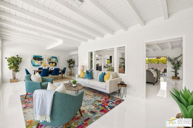 tiled living room featuring french doors and beamed ceiling